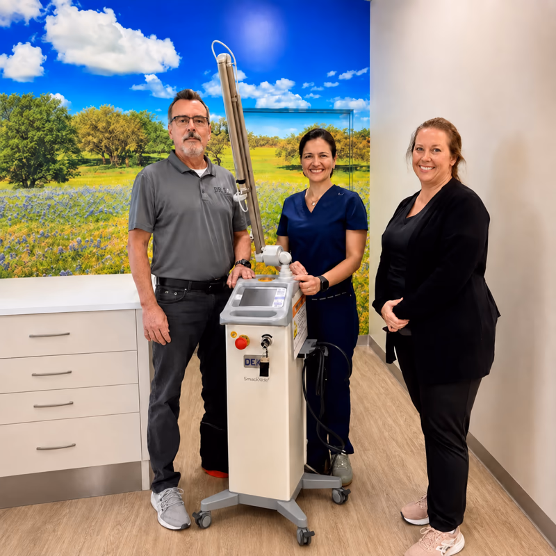 Dental practice team with their DEKA laser system