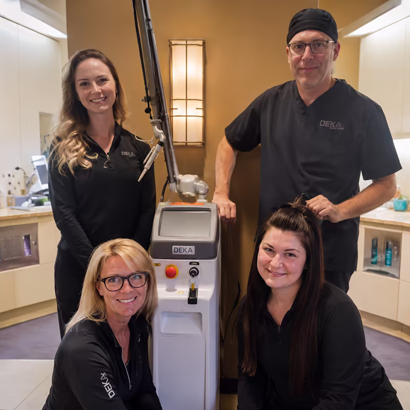 Dental practice team with their DEKA laser system