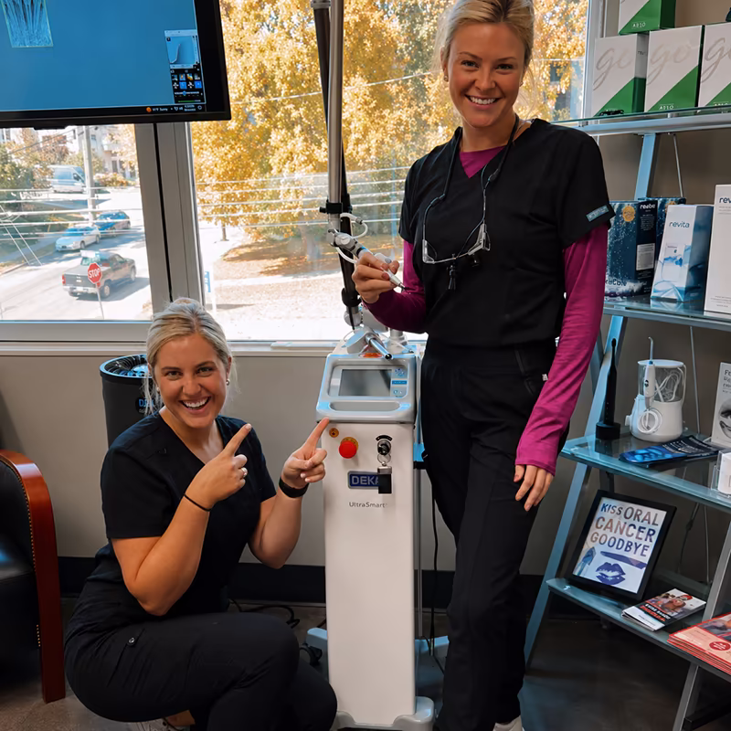 Dental practice team with their DEKA laser system