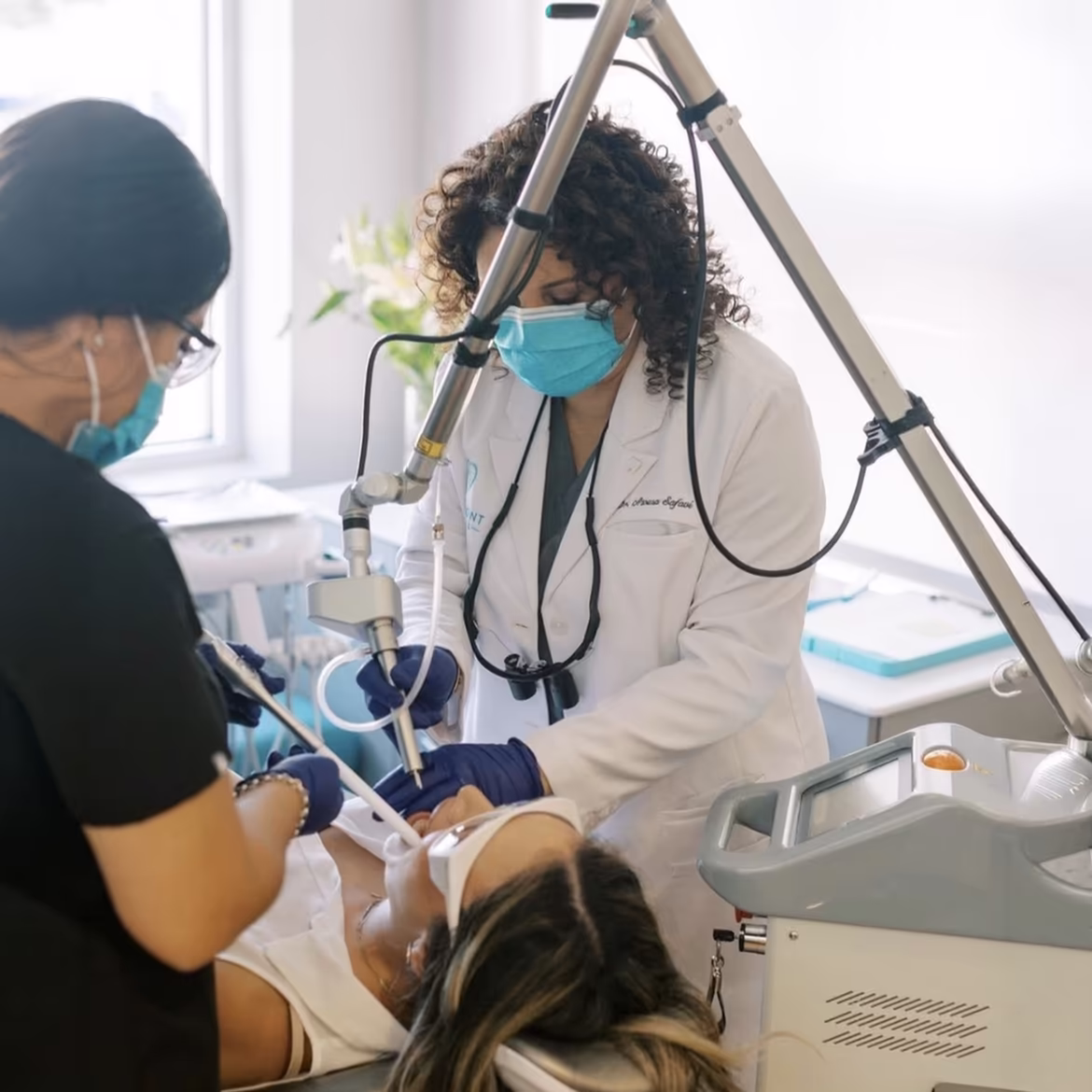 Clinician delivering laser therapy chairside